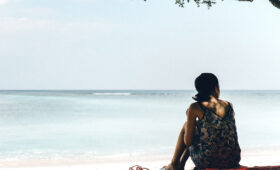 Girl on a lonely beach