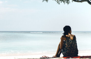 Girl on a lonely beach