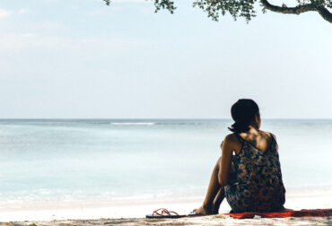 Girl on a lonely beach