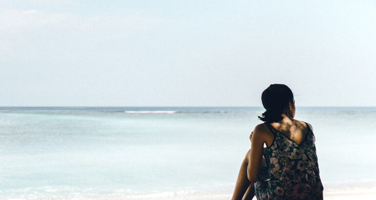 Girl on a lonely beach